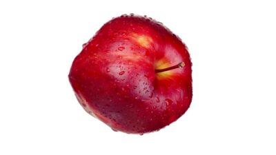 Tasty red apple with small peduncle covered with water drops