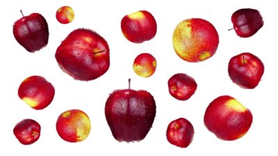 Many tasty and ripe apples on a white background