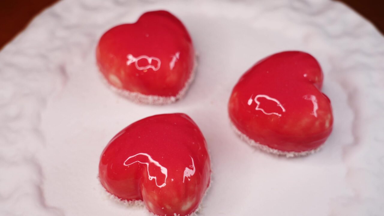 Small heart-shaped red cakes