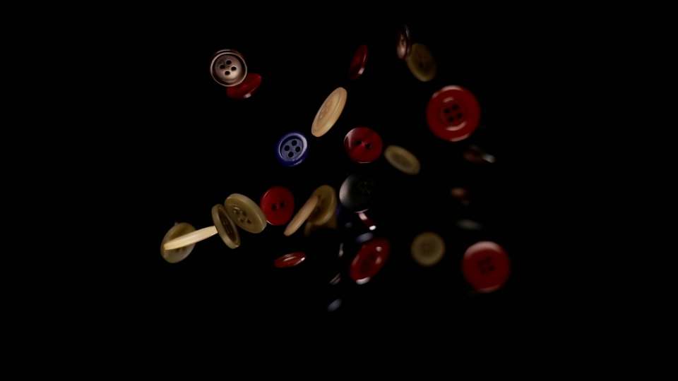 Bottoni per i vestiti colorati su sfondo nero