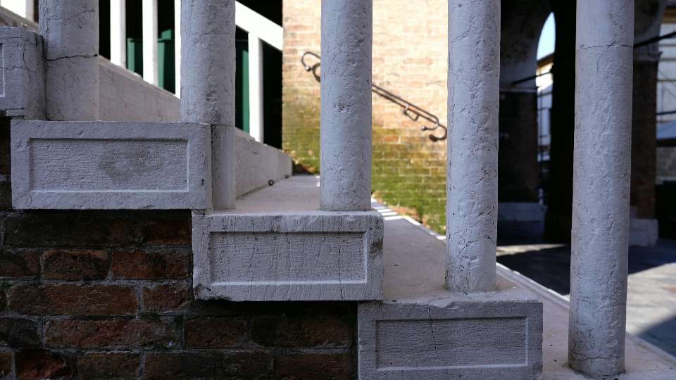 Ancient stairs with small marble columns