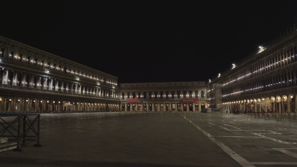 Panoramic view of spacious empty Saint Mark Square at night