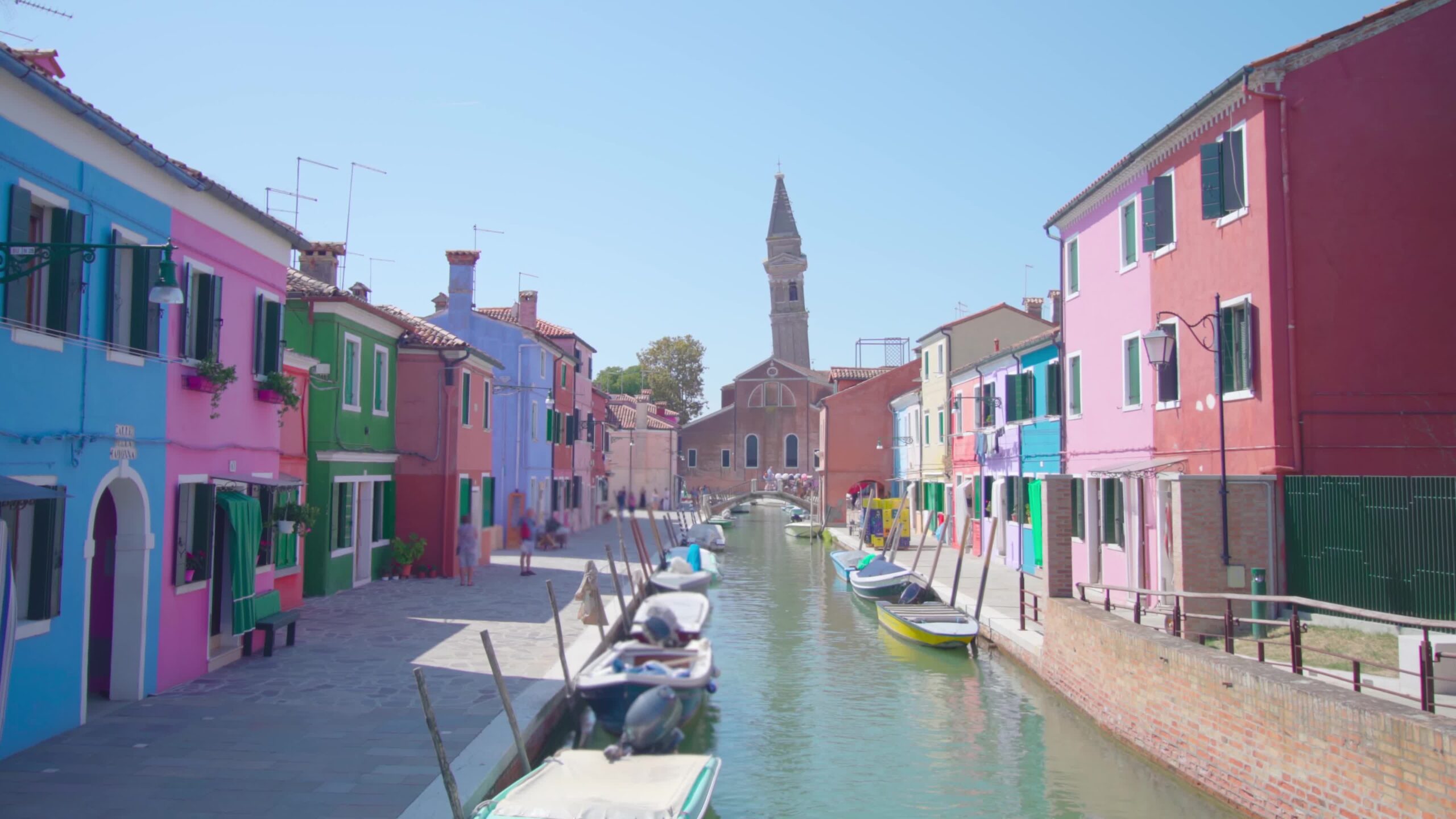 View of Venetian Burano island canal in sunny morning