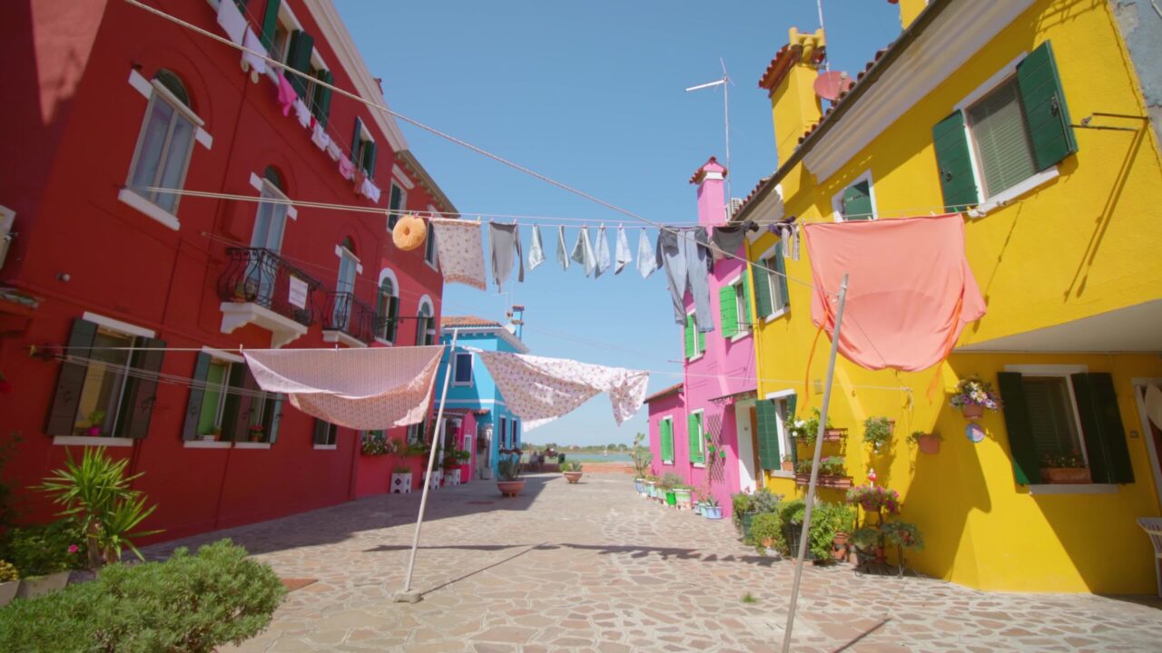 Colorful houses with clothes drying on stretched clothesline