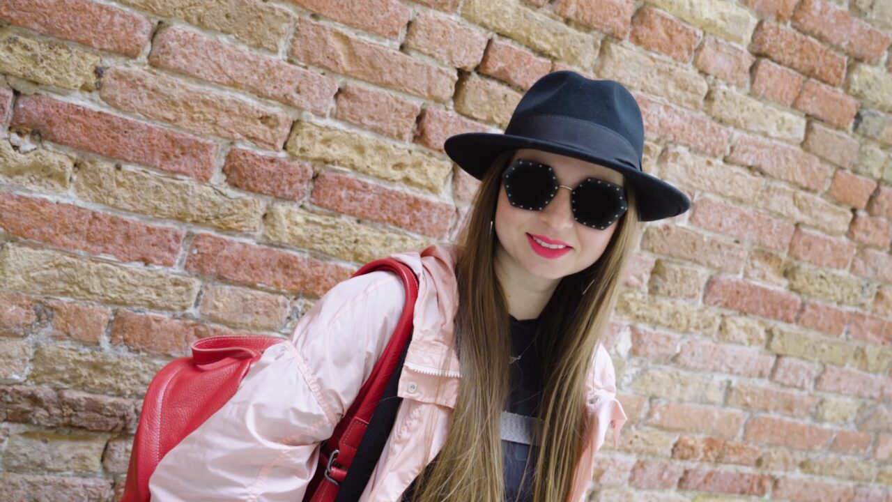 Woman in front of the wall