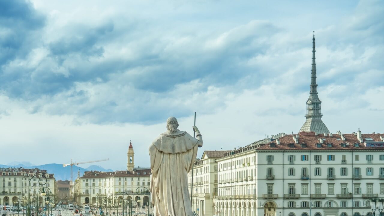 Historical monument against vintage buildings and cathedrals