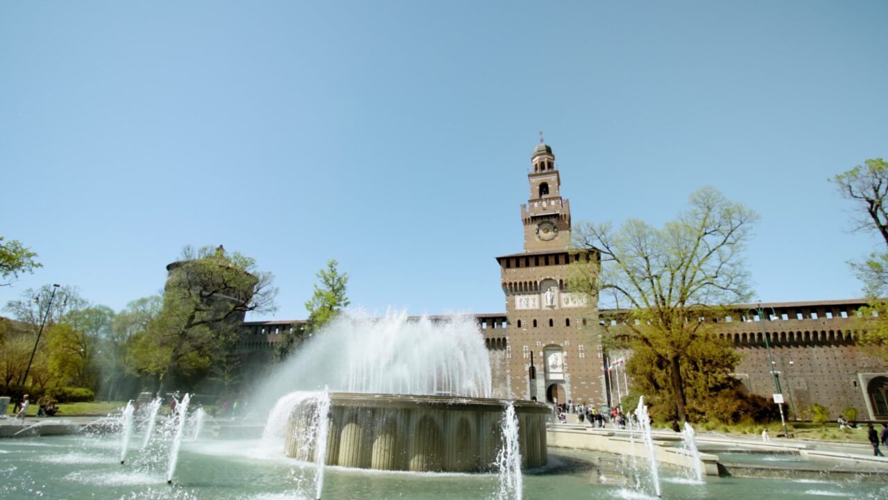 Fountain of Castle square against ancient building in Milan