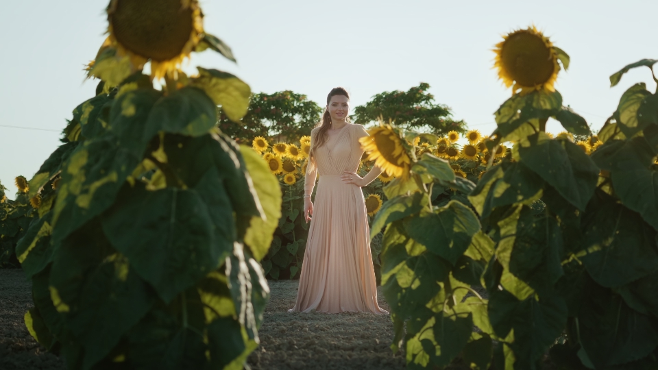 Elegant model among field plants