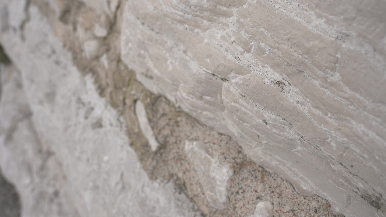 A wall of ancient boulders in the foreground