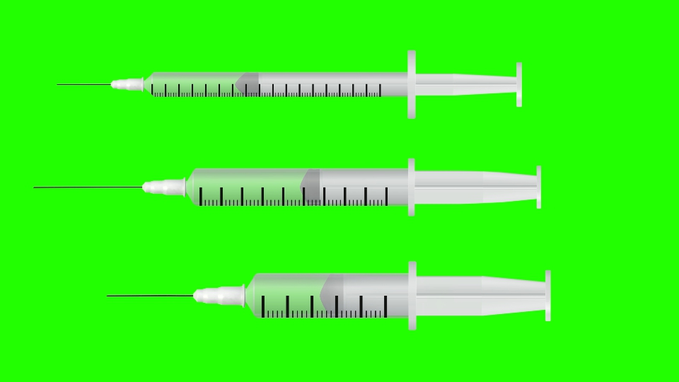Siringhe mediche sullo schermo verde