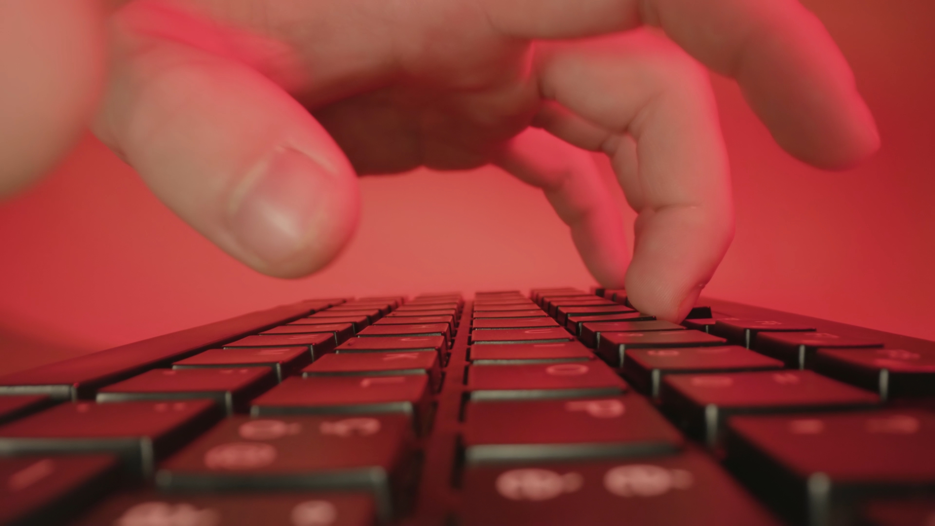 Man hands type on keyboard of computer at workplace