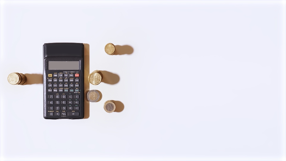 Calculator and coins on the sides