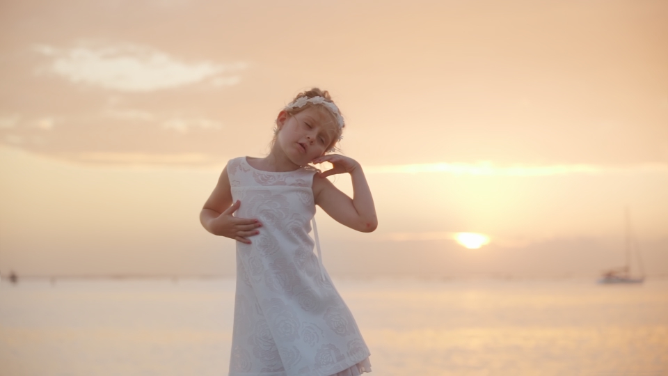Little girl dances in a fun way
