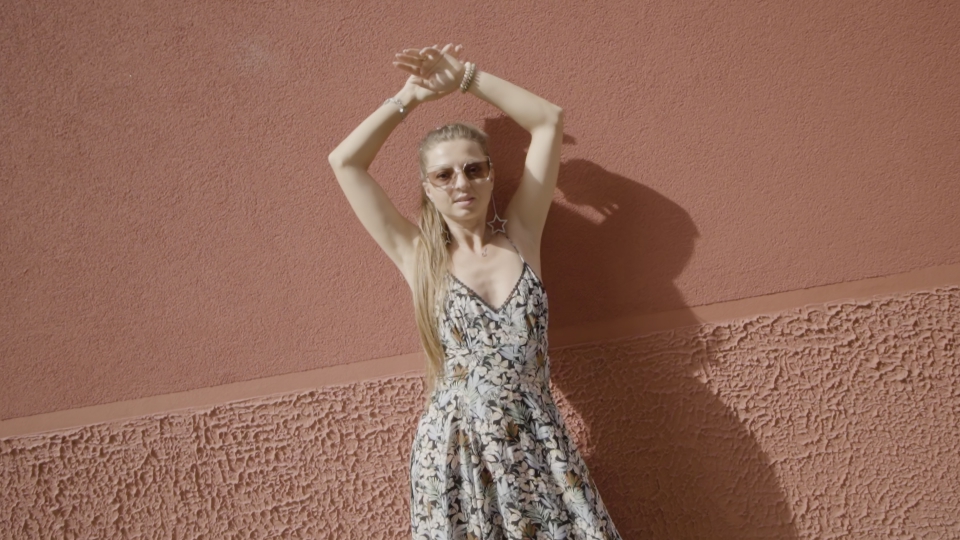 Graceful Dance Against the Red Wall