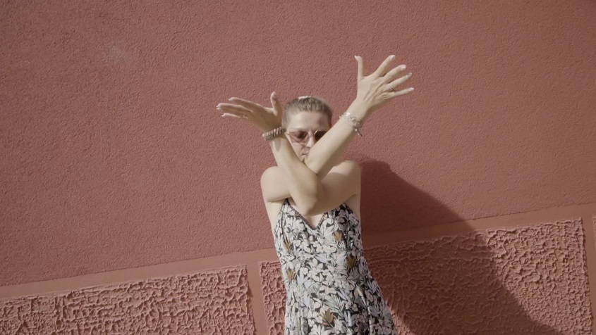 Graceful Movement Against the Red Wall