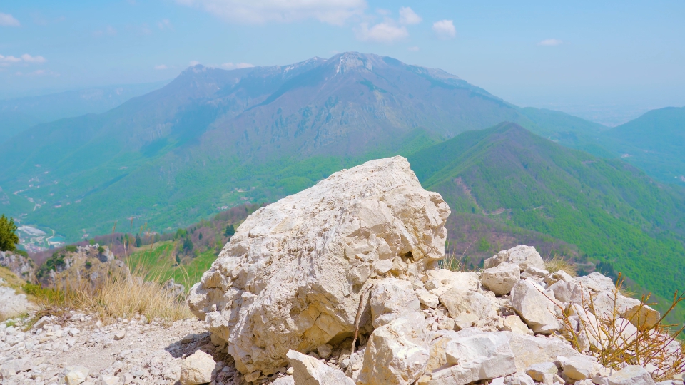 Mountain Rocks Amidst Green Hills Panorama