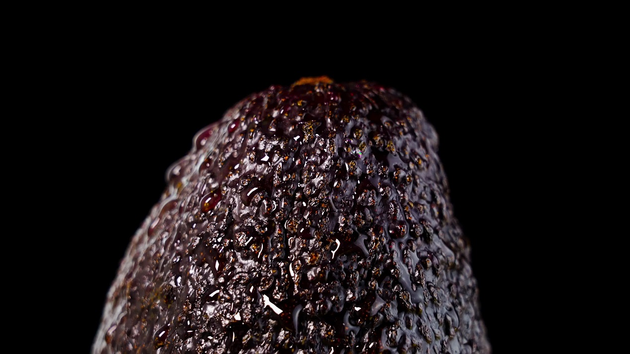 Part of bright ripe mango on black background