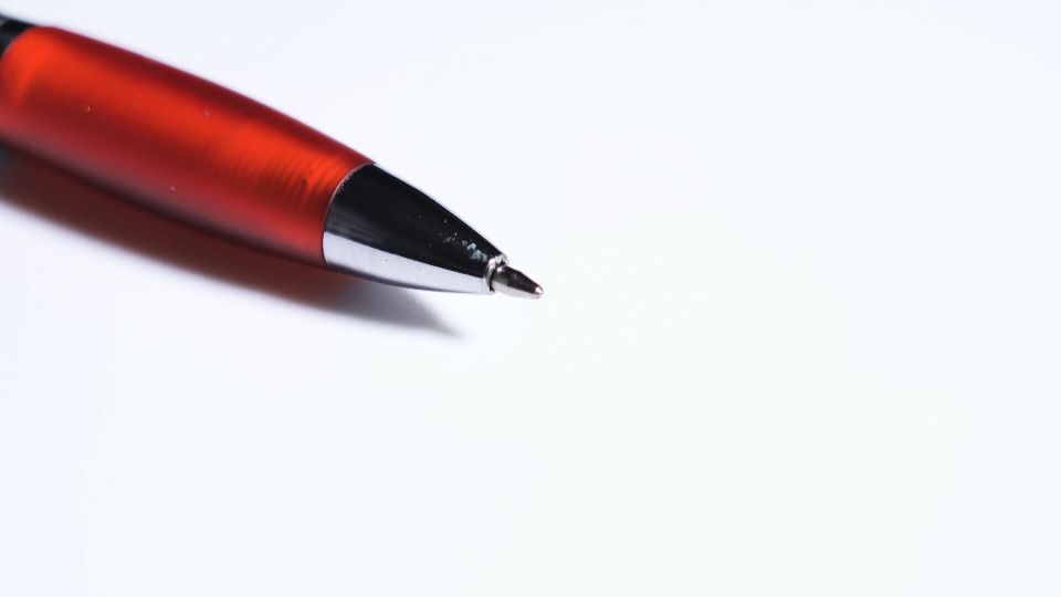 Writing pen rotates on white background