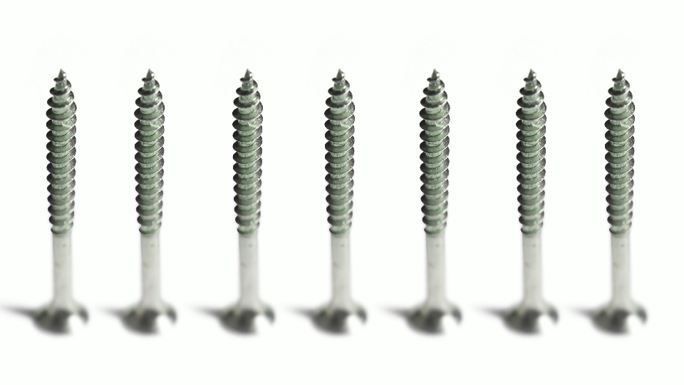 Mechanical Precision: Screws Turning on a White Background