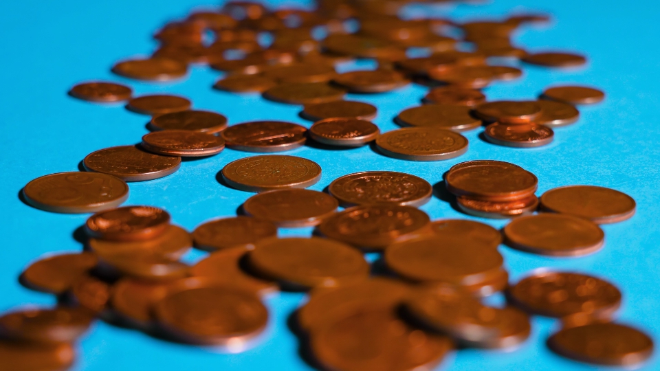 Few cent coins on blue surface