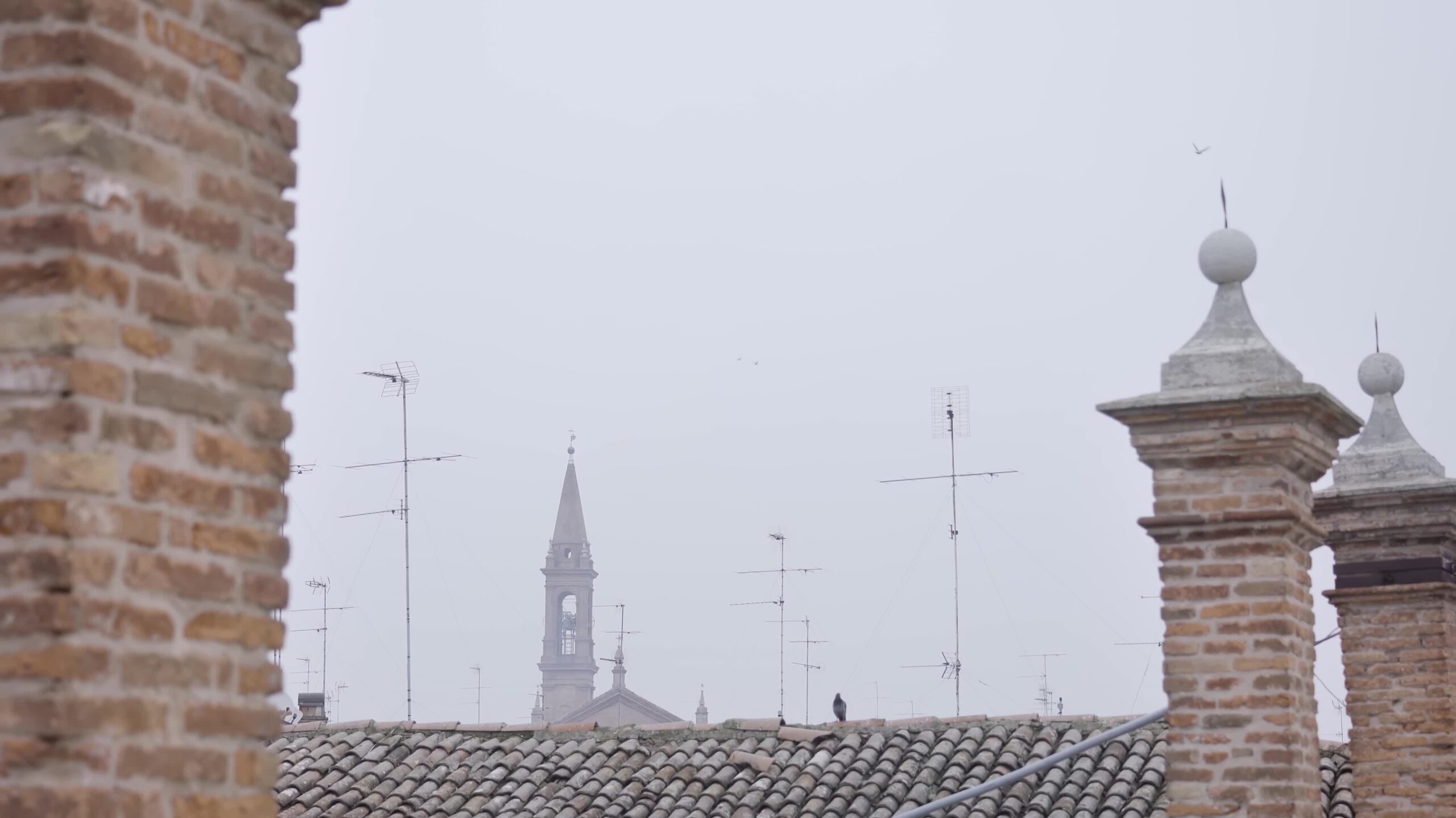 Above ancient Italian roofs of Emilia-Romagna