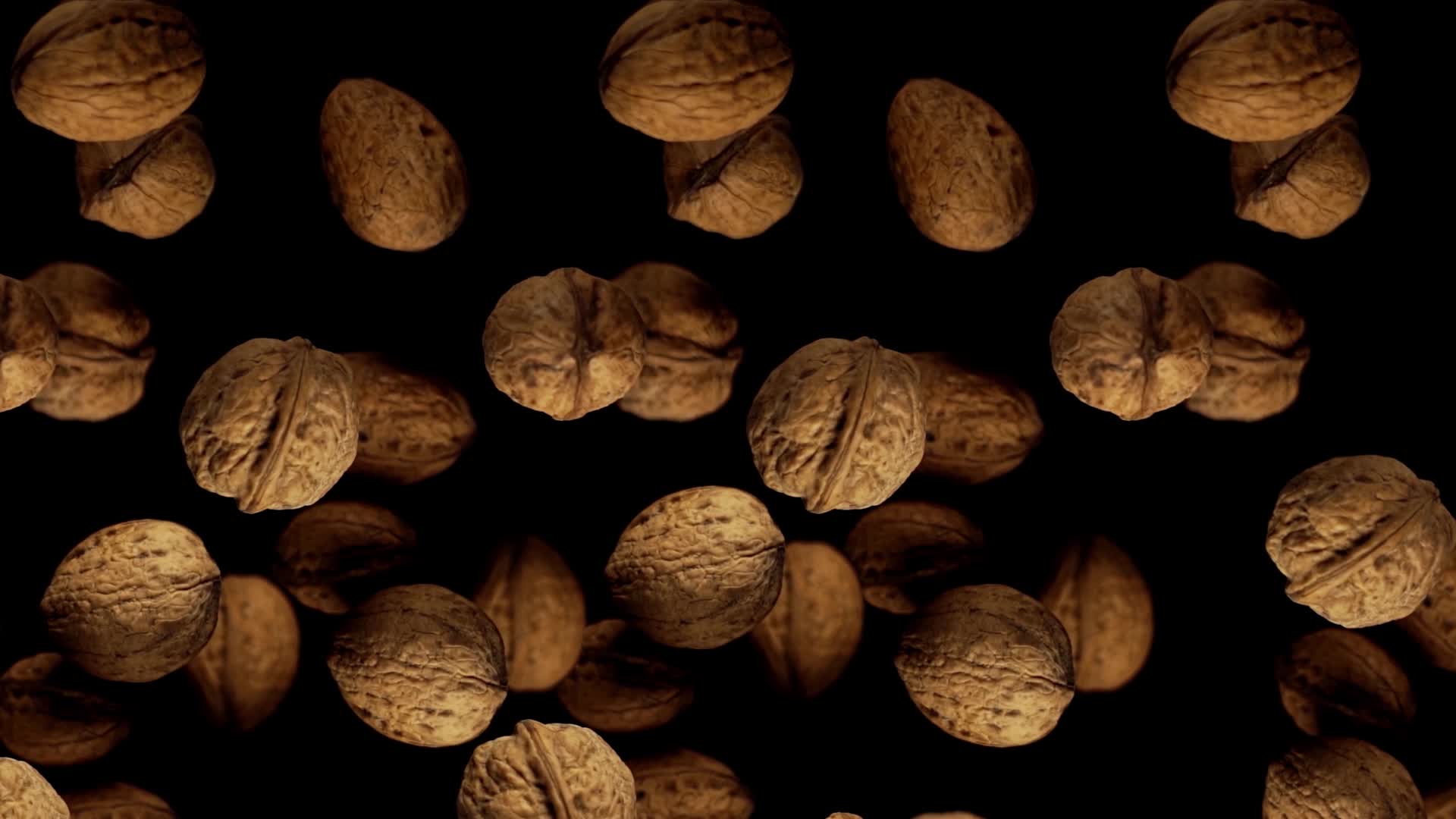 Nuts are spinning on a black background