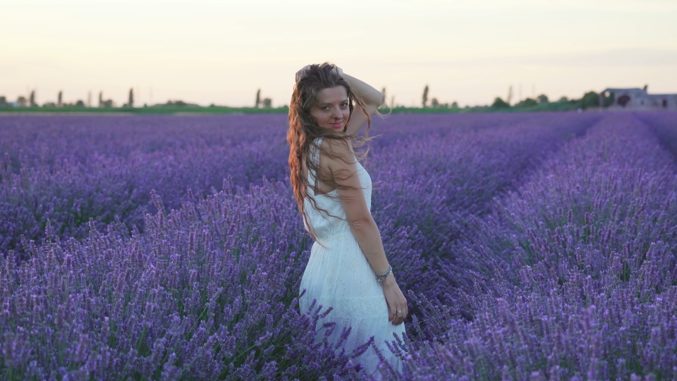 Beautiful colorful lavender field and smiling woman