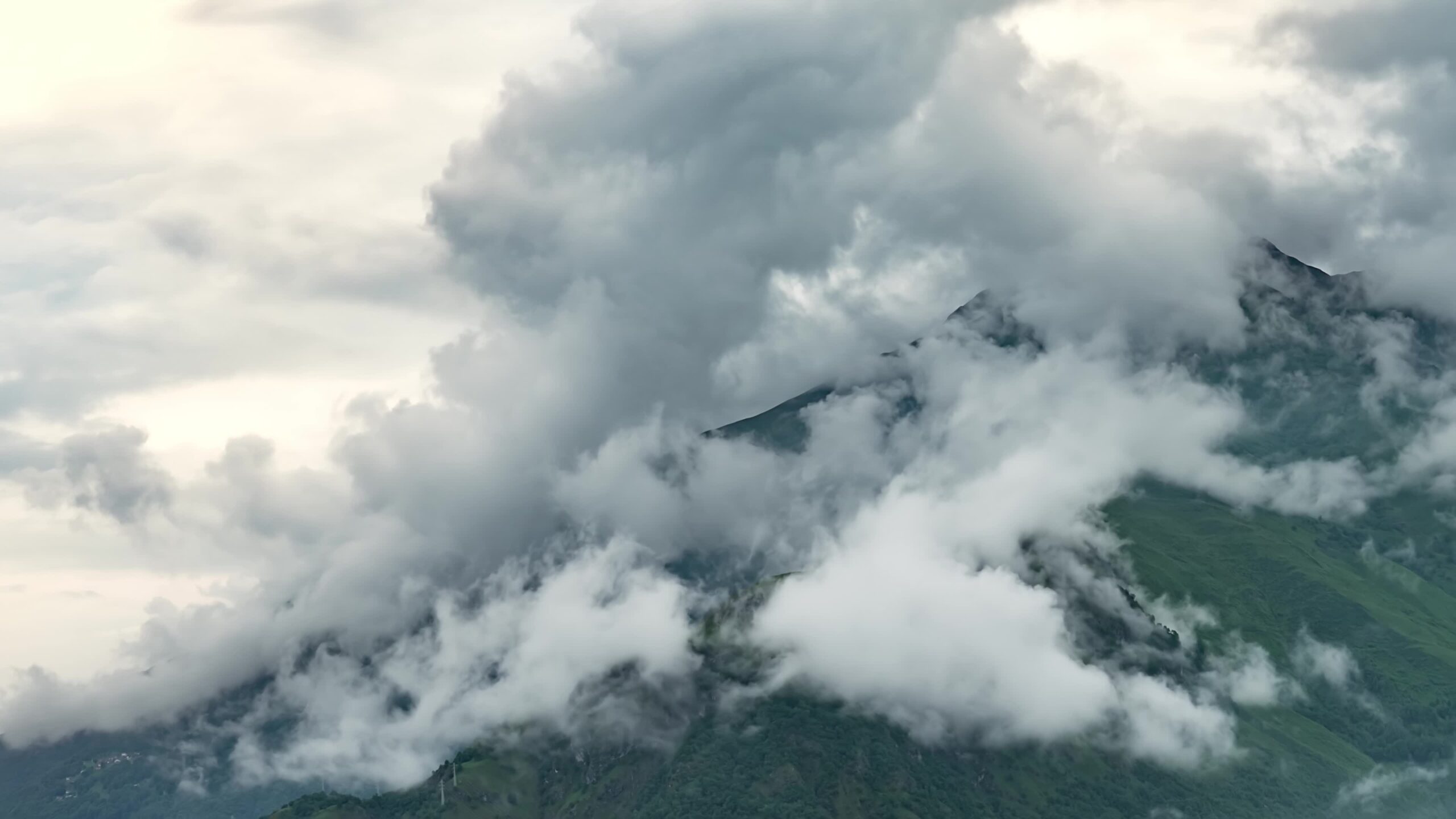 Moving Clouds in the Majestic Green Mountains