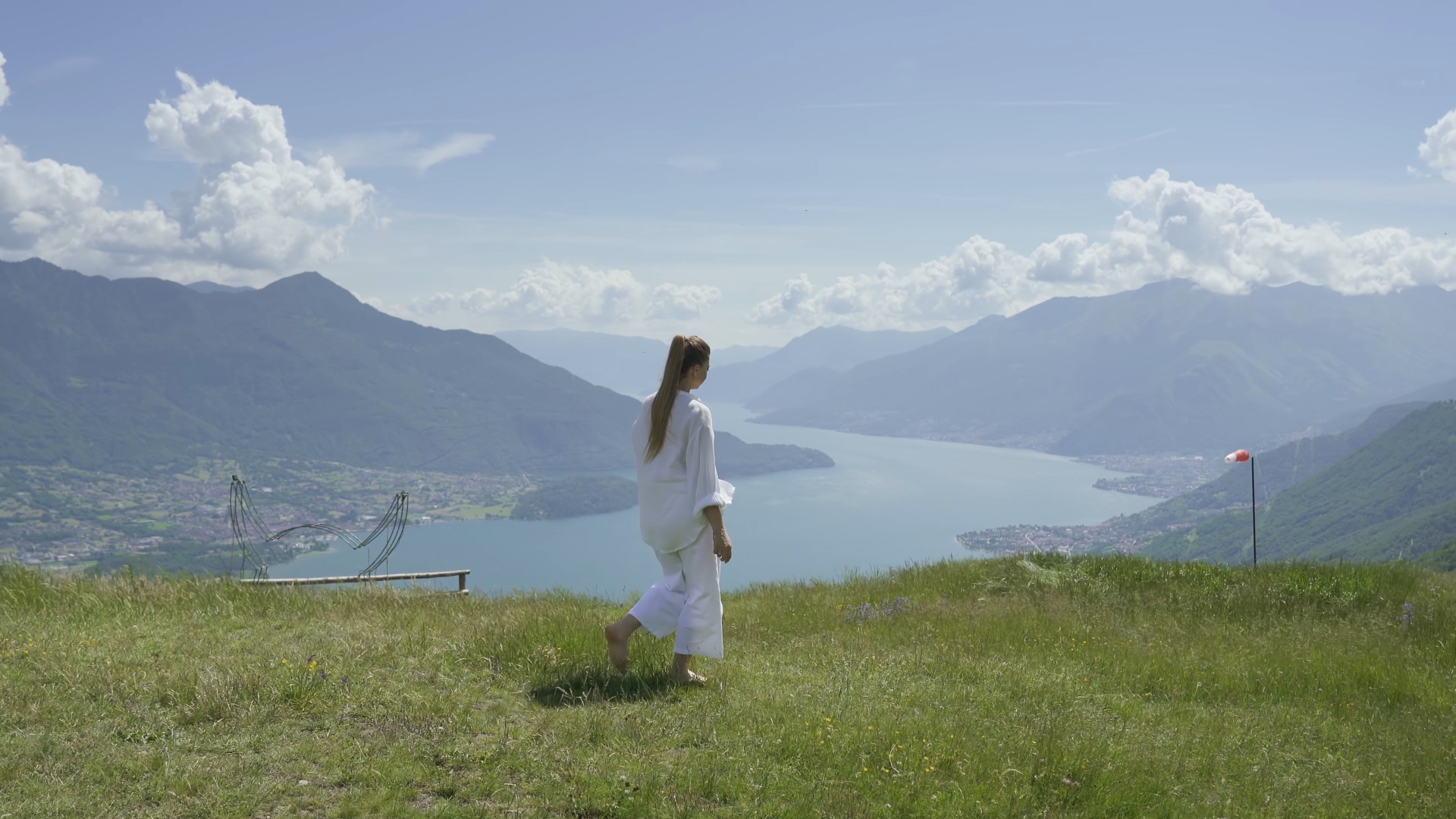 Young Woman Strolling Relaxingly Amidst Mountains and Lakes