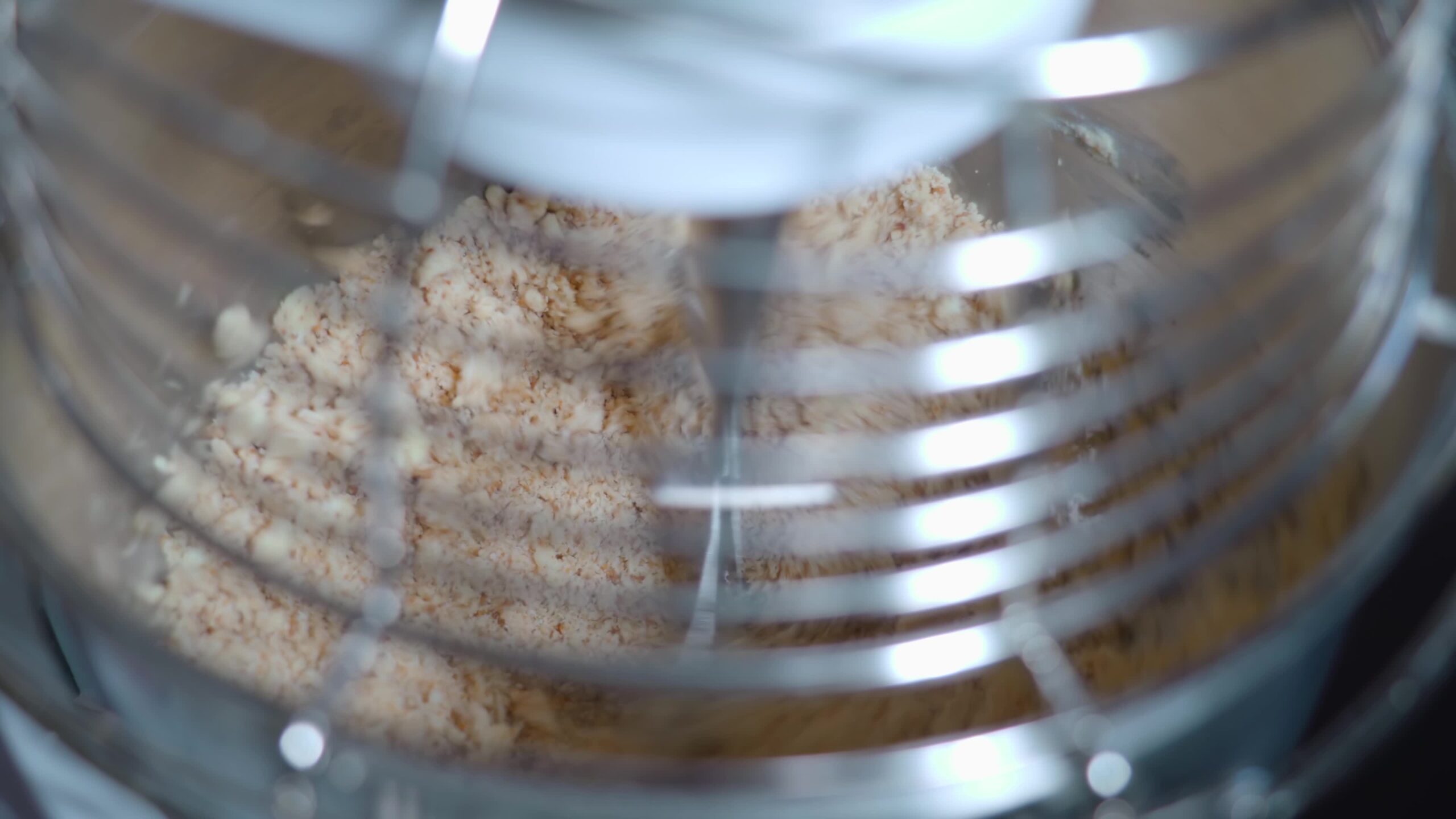 The chocolate is mixed quickly in the machine
