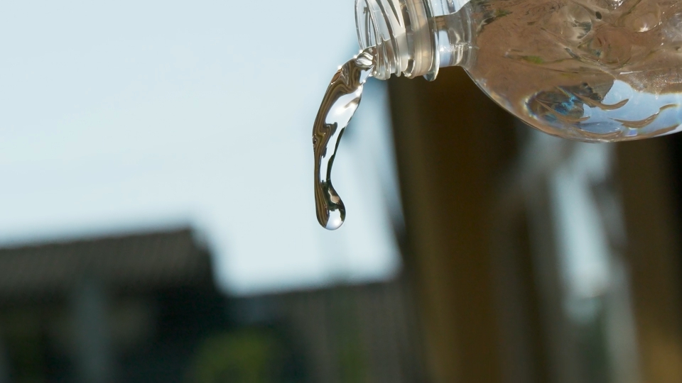 Water being poured from the bottle in slow motion