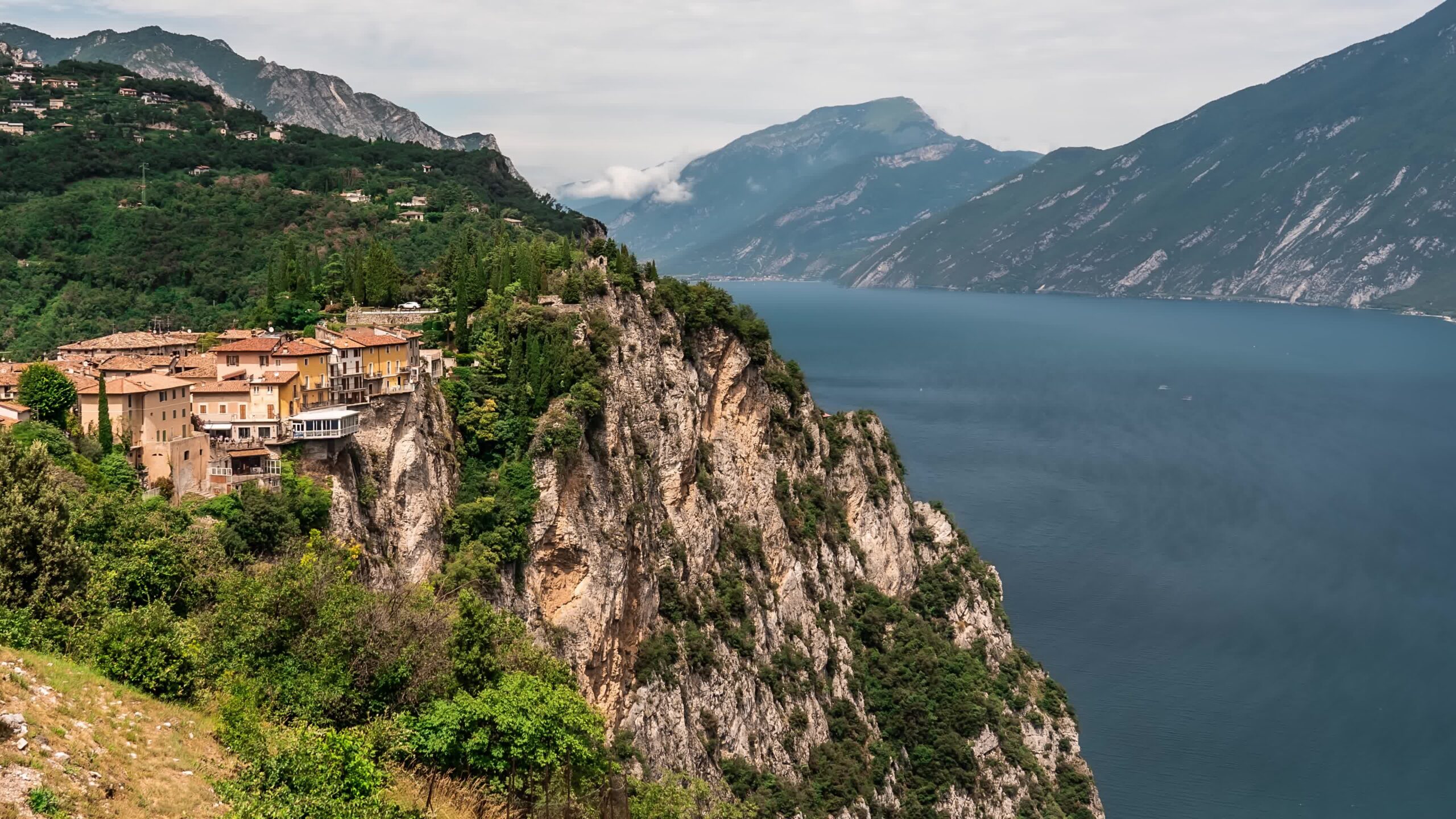 Buildings suspended on the rocks above Lake Garda