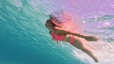 Free Diver Swimming in Crystal Blue Sea Waters