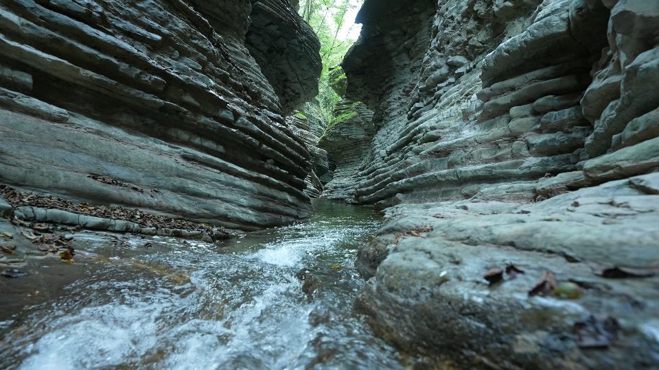 Stream flows between mountains