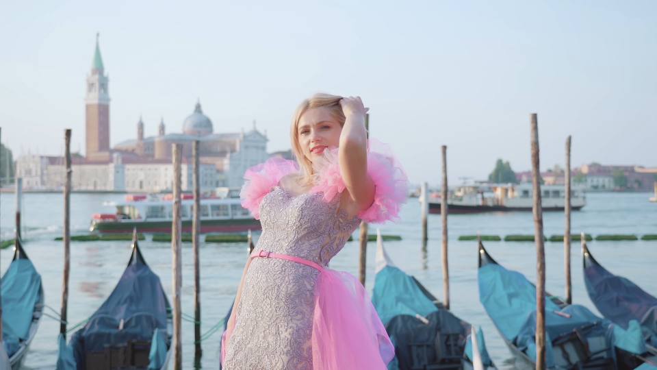 Tourist in elegant dress in Venice