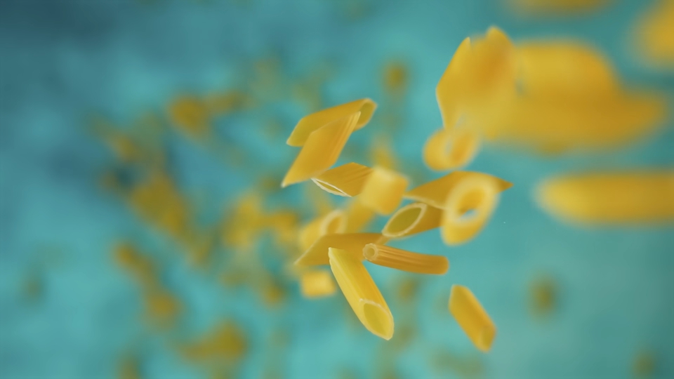 Pasta falls in slow motion in the kitchen