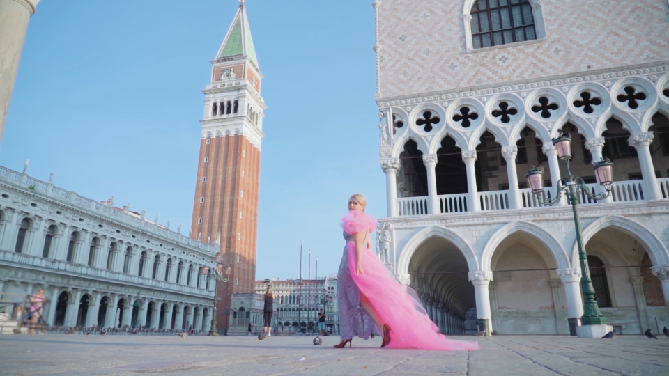 Woman in elegant dress in San Marco square