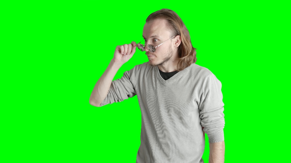 Man Lowering Sunglasses in Silent Observation