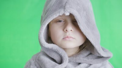 Serious Gaze of a Hooded Girl