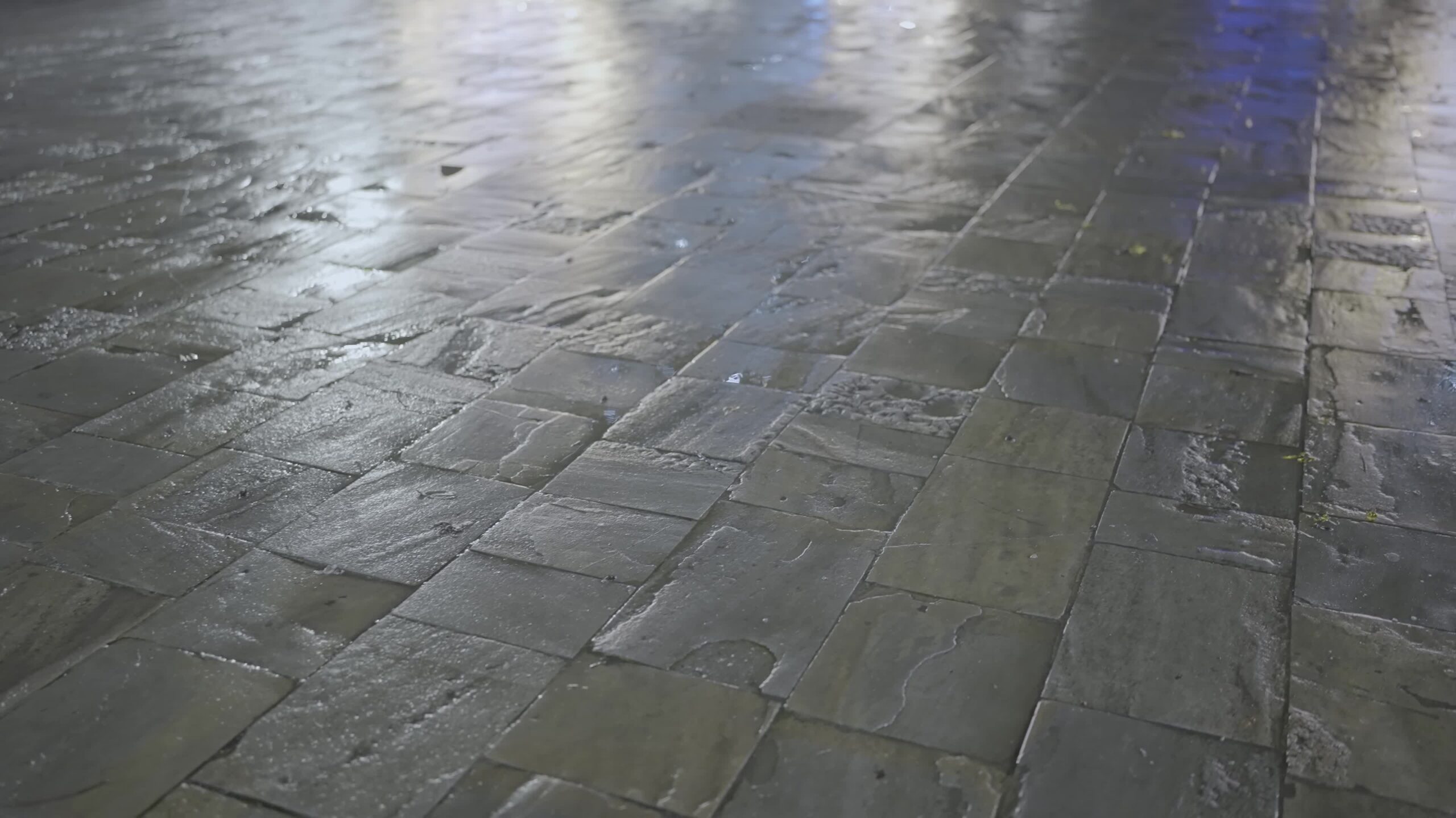 Roman Stone Street: Nighttime Reflections in the Rain