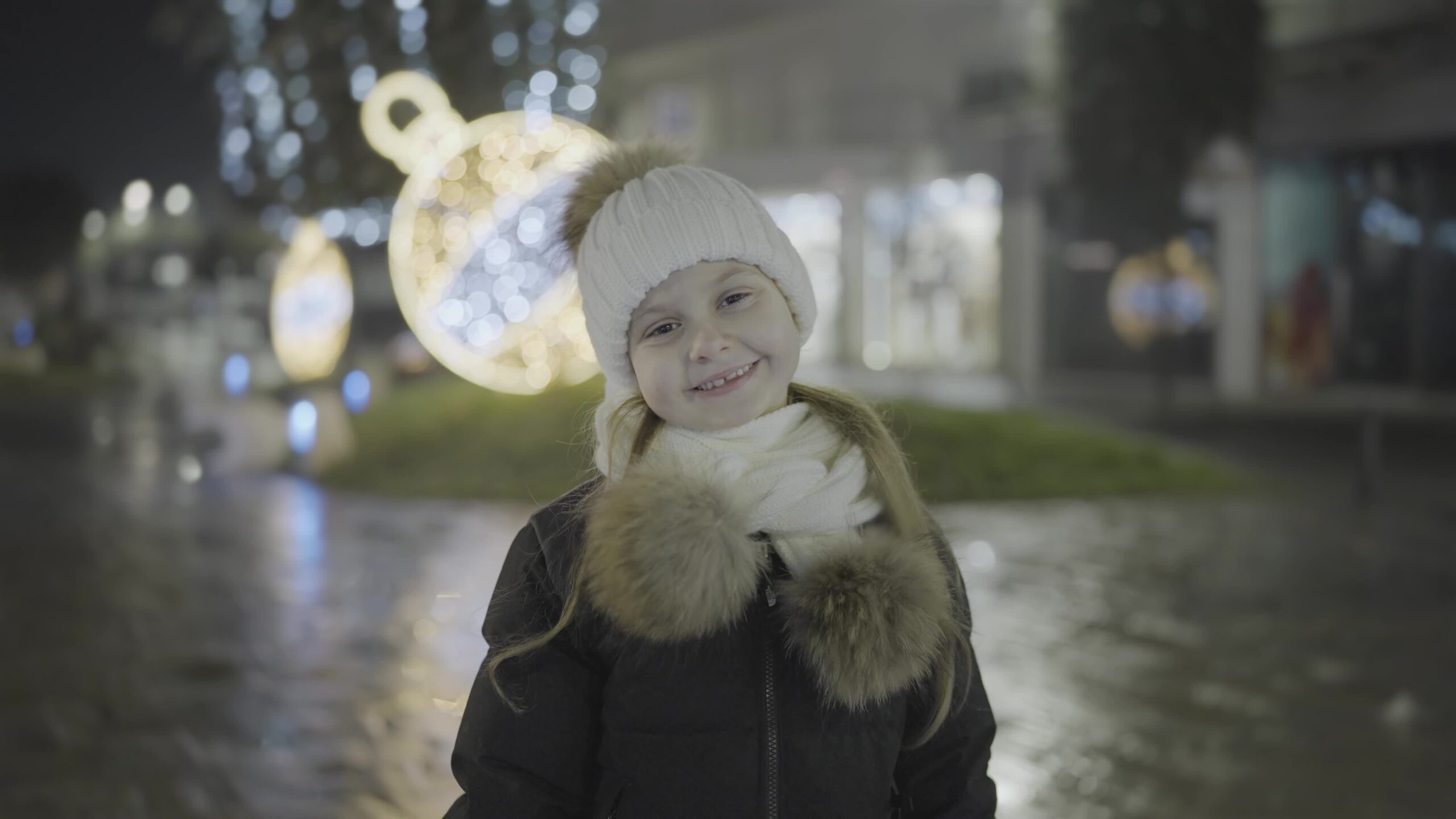 Winter Smile: A Happy Child in the Illuminated City