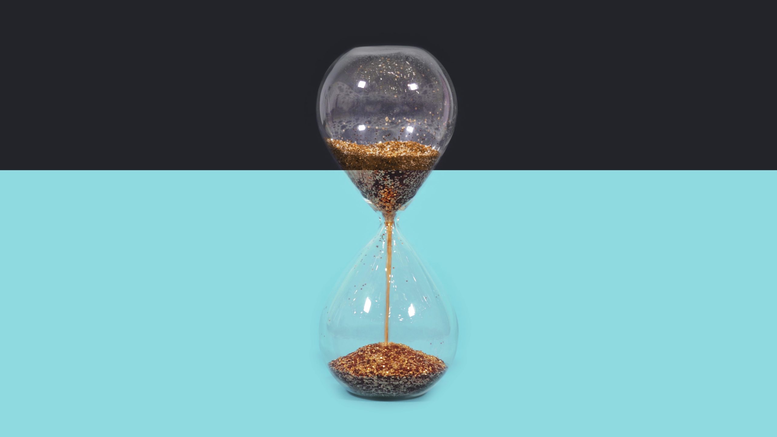Hourglass on color changing background
