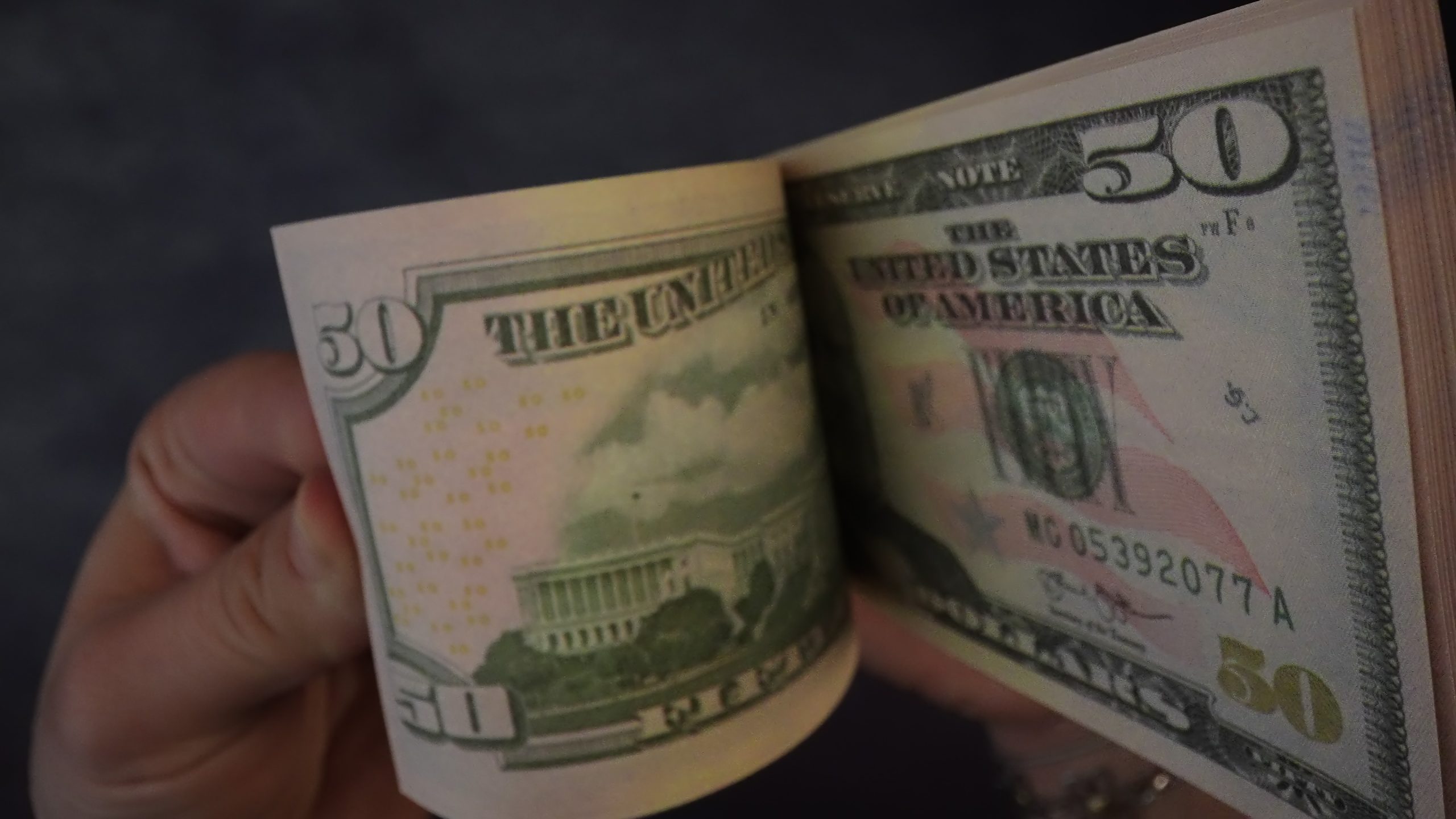 Banknotes are counted with fingers