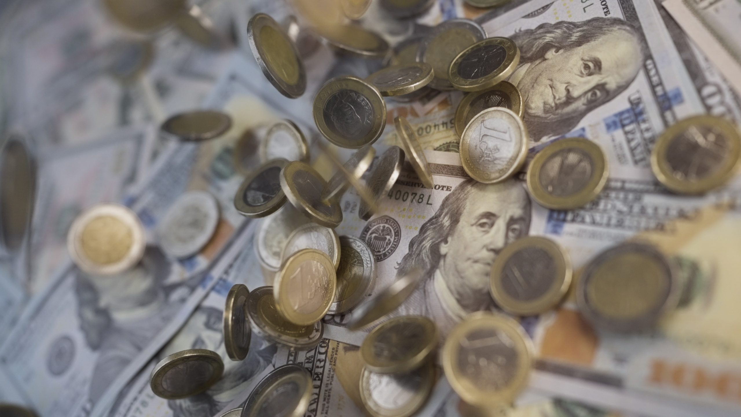 Cascade of coins in slow motion