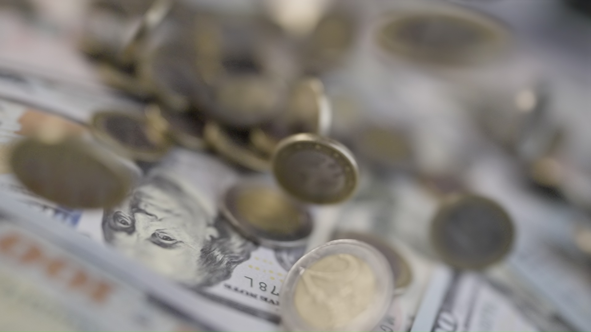 Coins embossed on dollar banknotes
