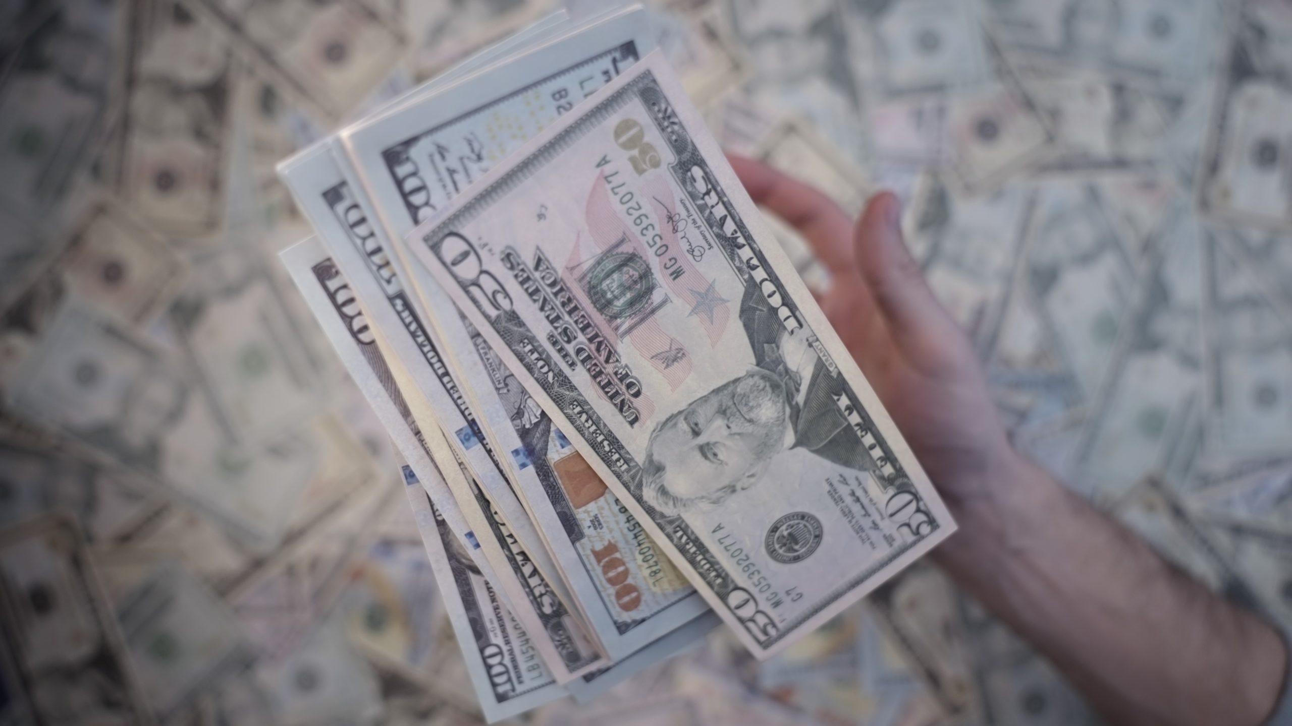 Dollar banknotes are thrown high