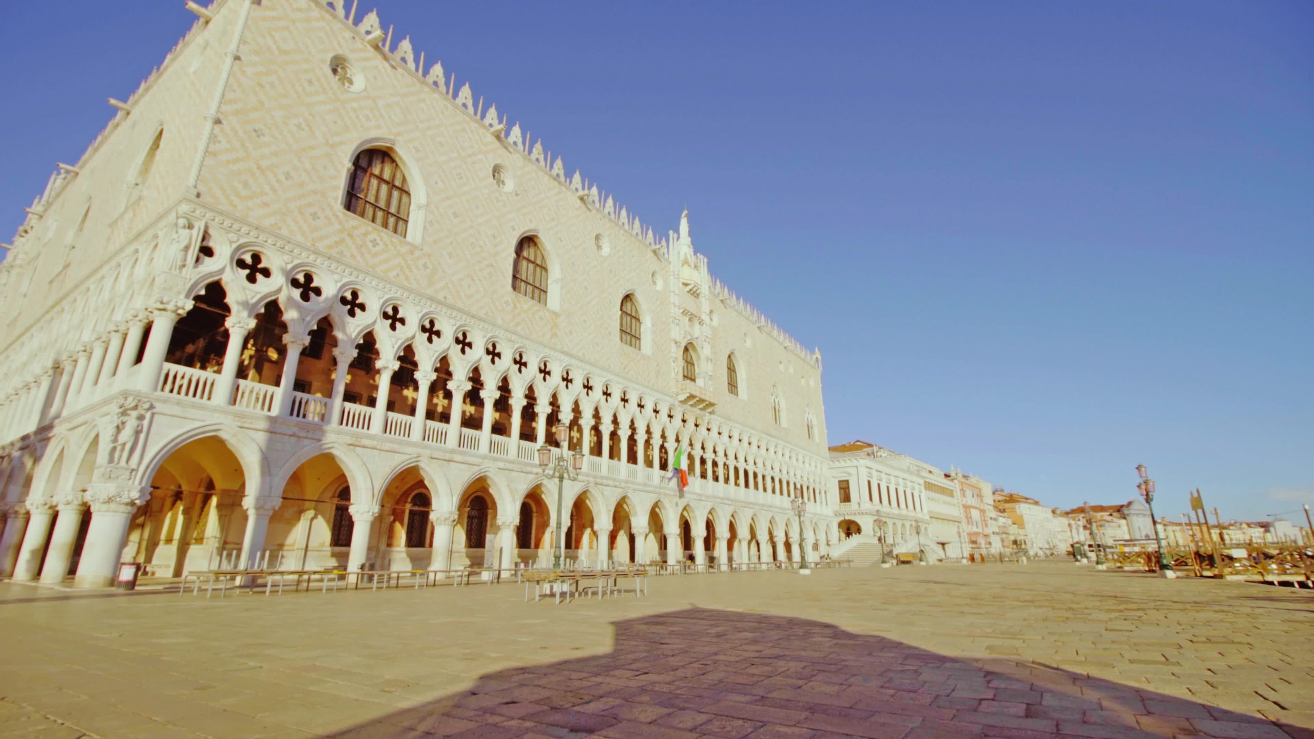 Doge’s Palace with Italian flag on the wall