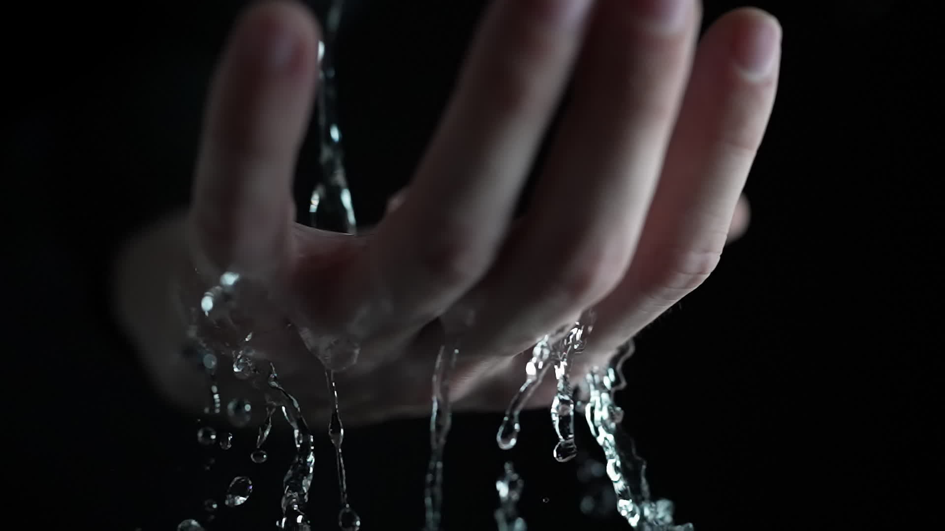 Hand with Water Streaming Down