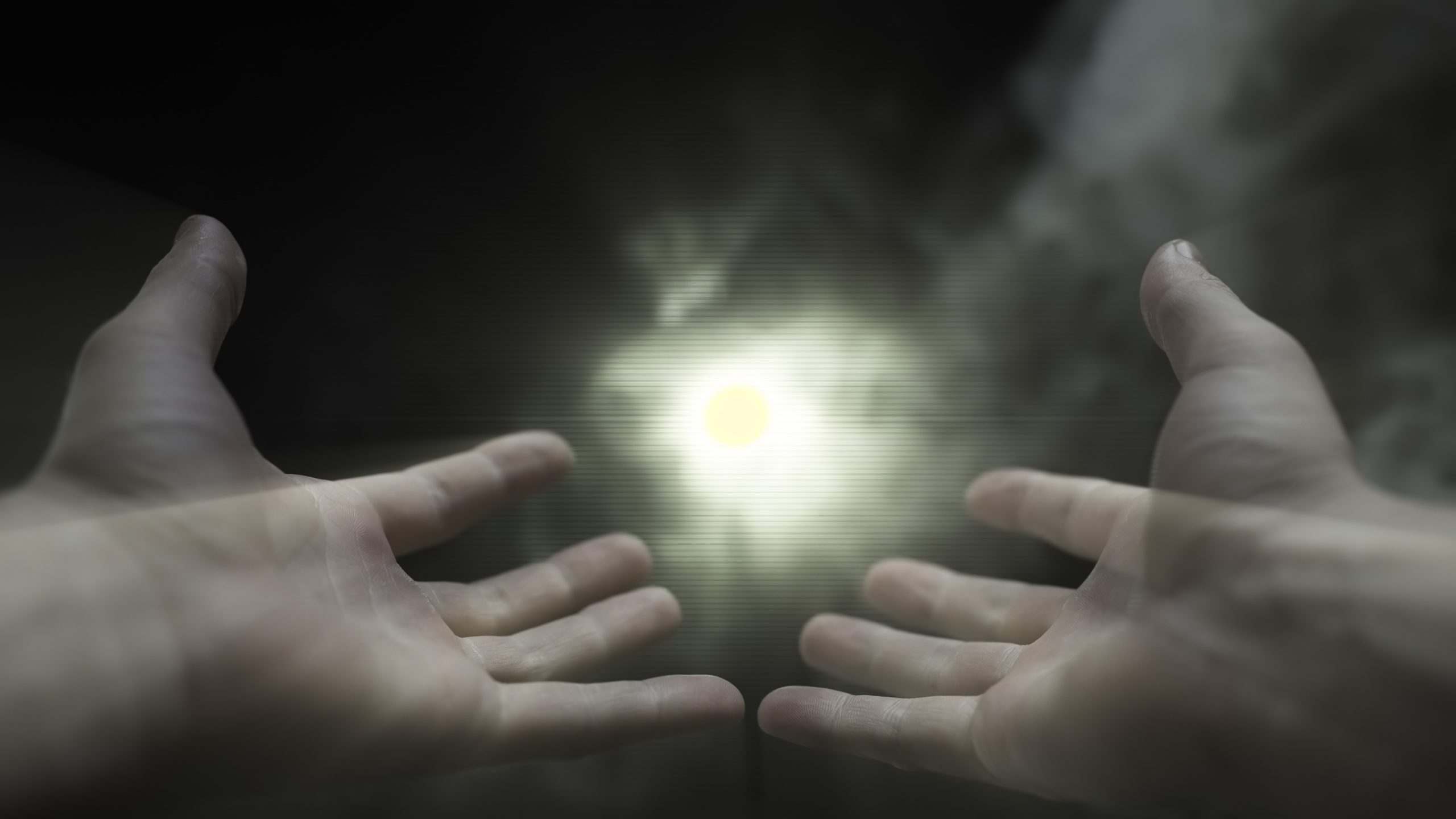 Hands Reaching Towards Light