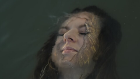 Woman Floating Peacefully Underwater